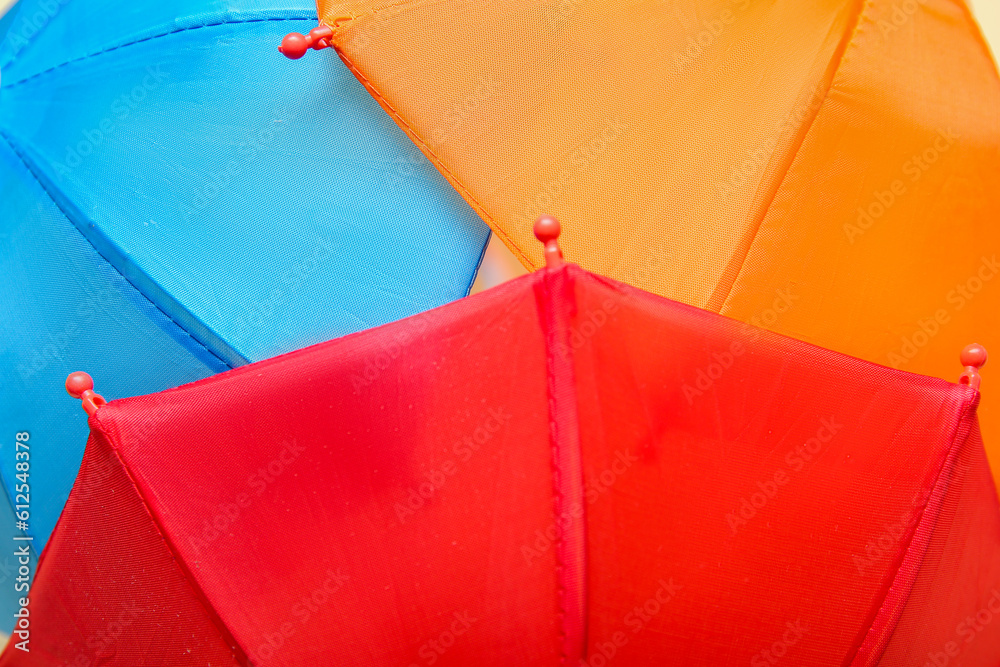 Texture of different mini umbrellas as background