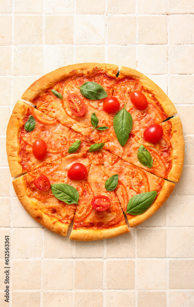 Tasty pizza margarita on beige tile background