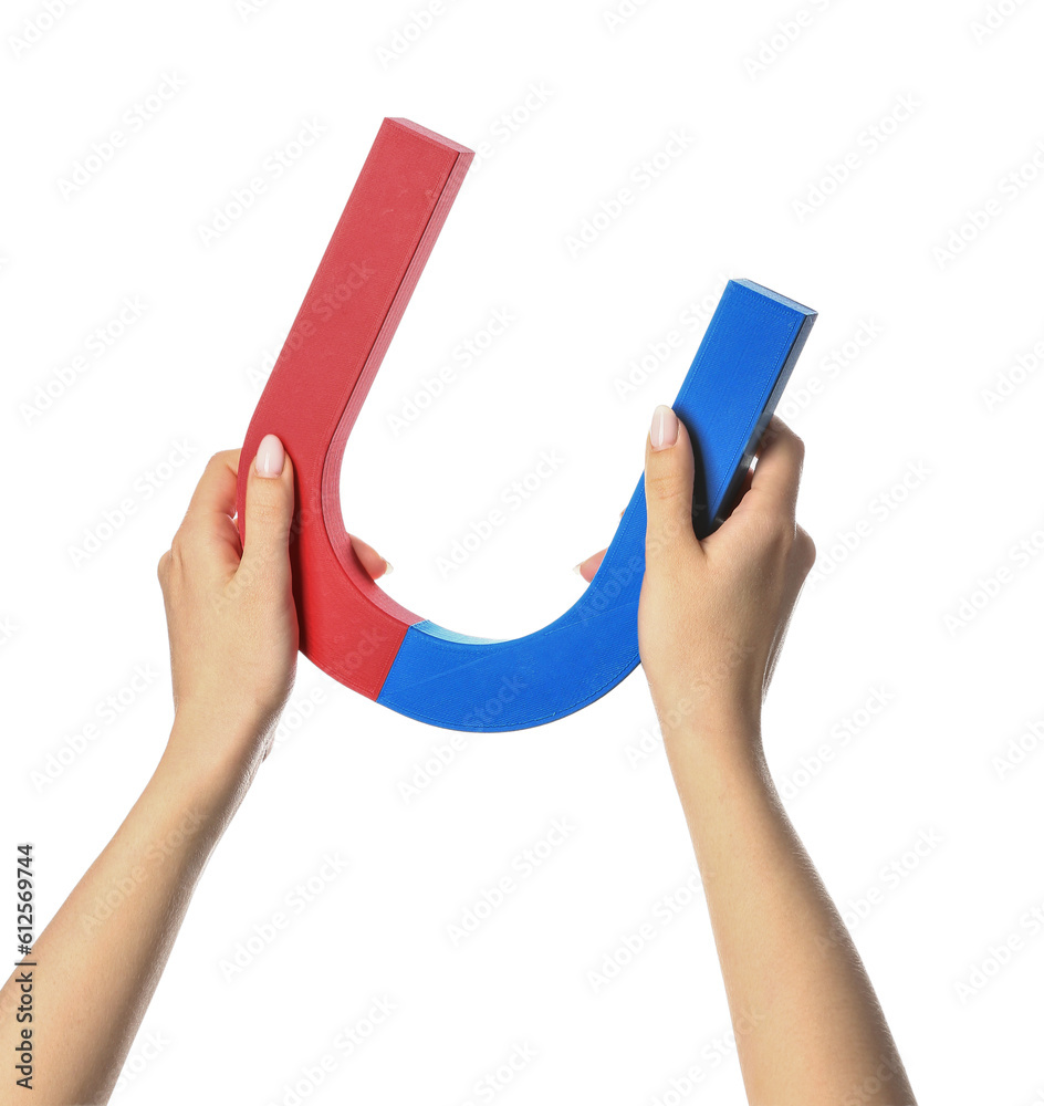 Female hands with magnet isolated on white background