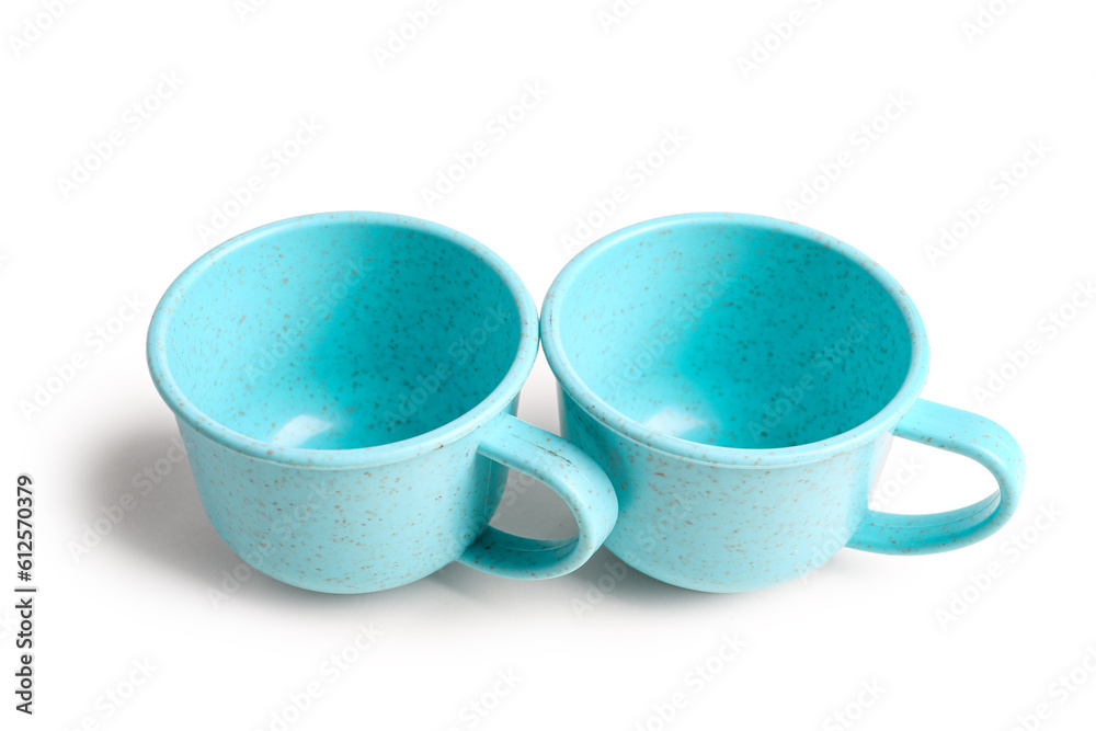 Blue cups isolated on white background. Childrens Day celebration