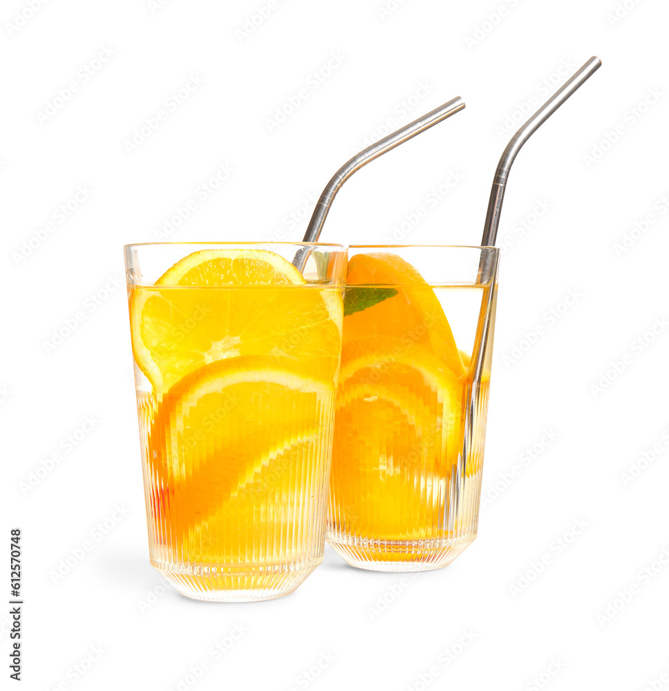 Glasses of infused water with orange slices on white background