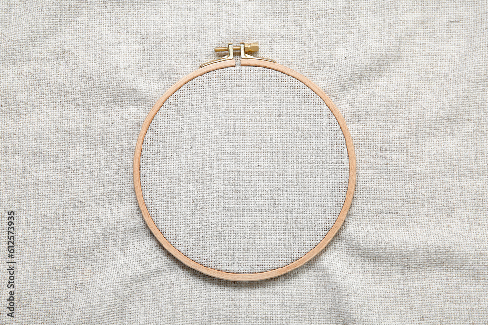 Wooden embroidery hoop with canvas as background