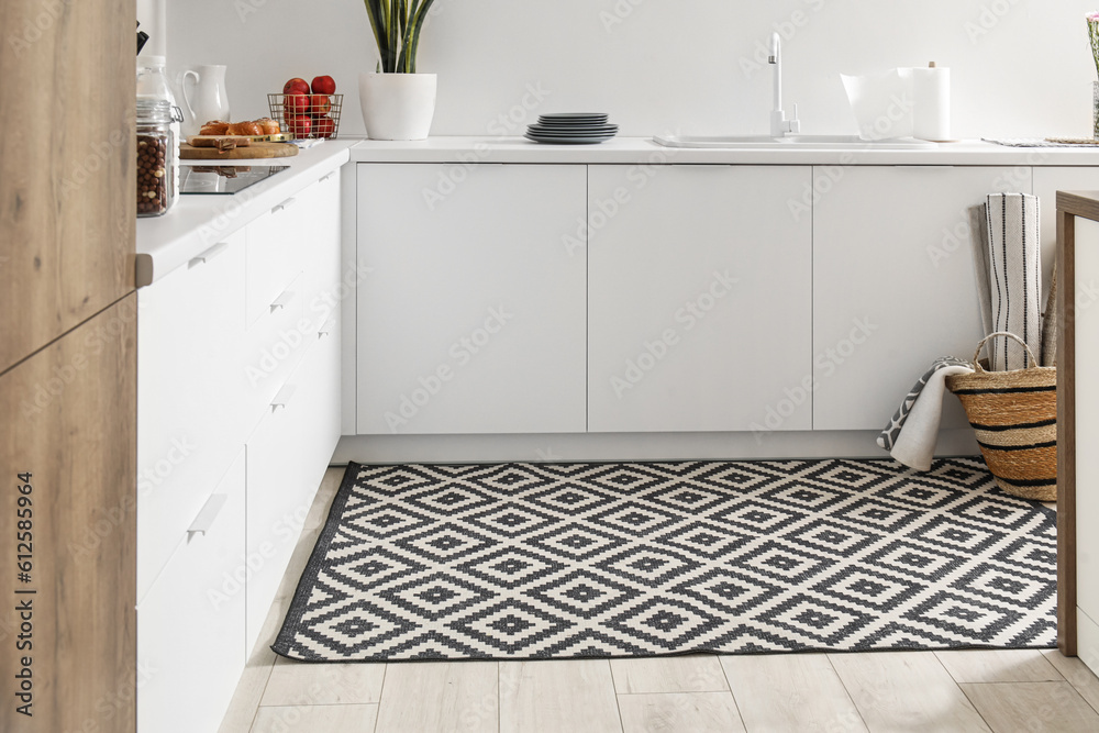 Stylish carpet in interior of modern kitchen