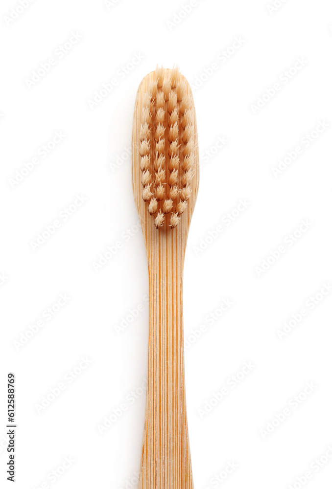 Bamboo toothbrush on white background