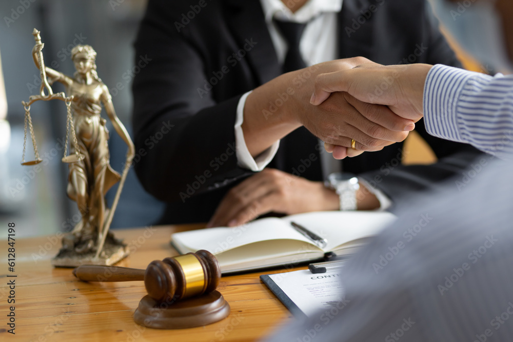 Legal consulting services, legal negotiations, lawyers shake hands with clients after negotiating an