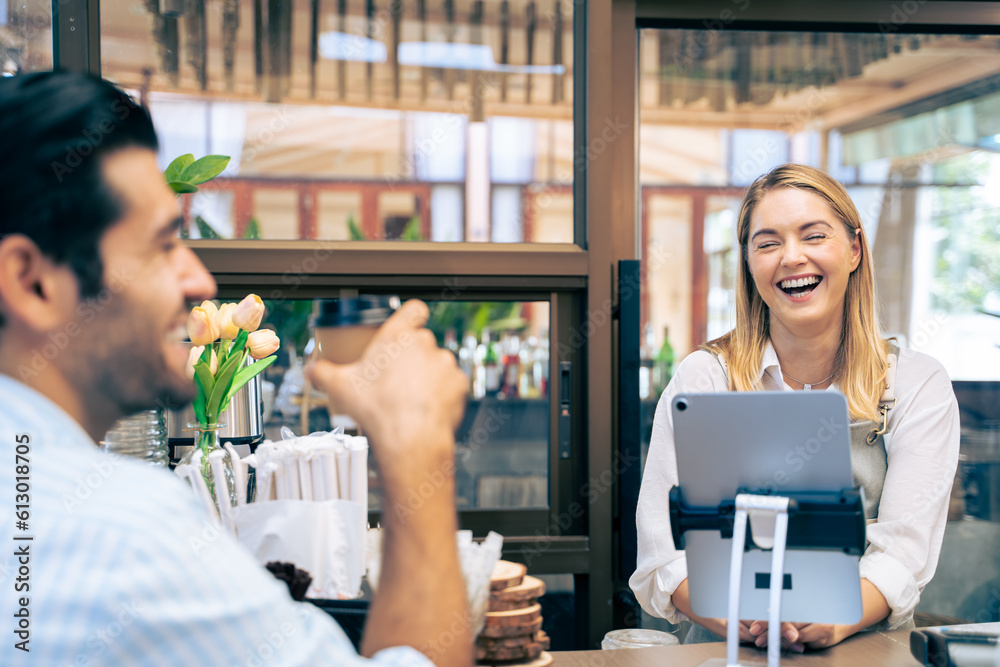 Caucasian attractive man receive hot coffee from waiter in coffee house. 