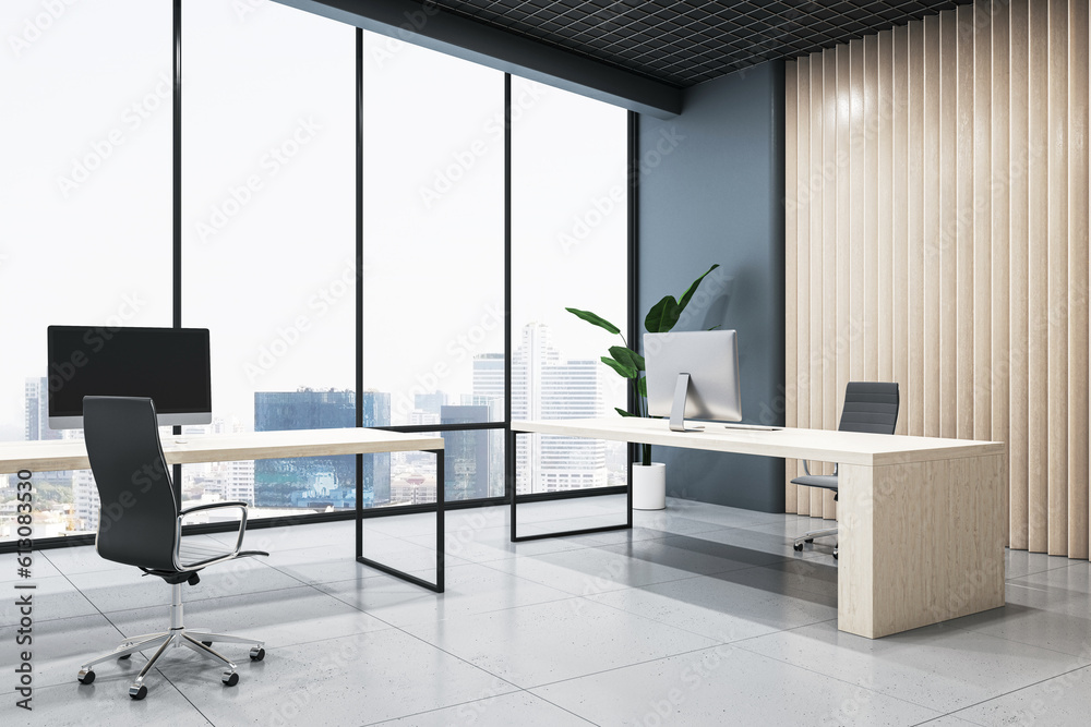 City view background from panoramic window in spacious coworking office with light wooden work table