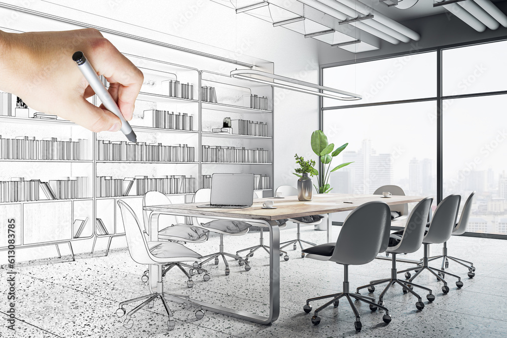 Handwritten sketch of modern meeting room interior design with man hand drawing bookshelf by pencil 