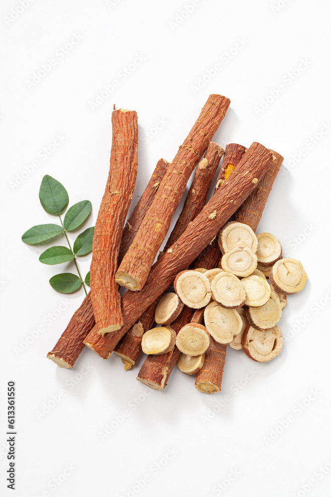 herbal medicine licorice root sticks and slices with leaf isolated on white background.