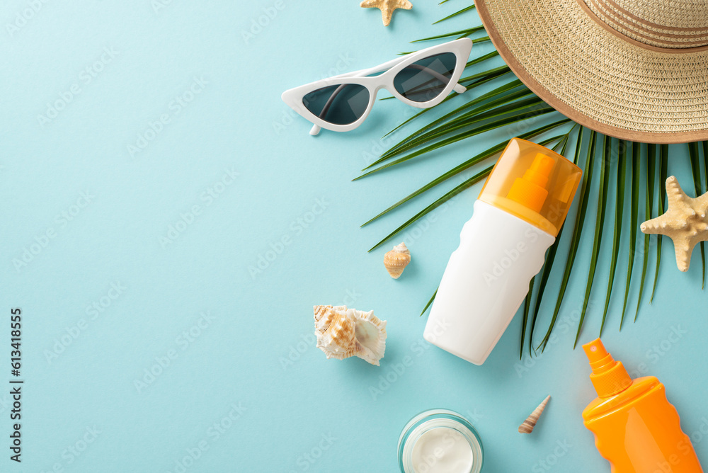 UV Safety Awareness Month. High angle view photo of sun protection lotion, sunglasses, straw hat and