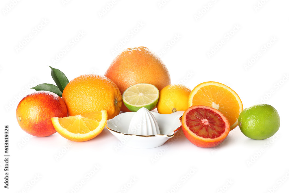 Ceramic juicer and citrus fruits on white background