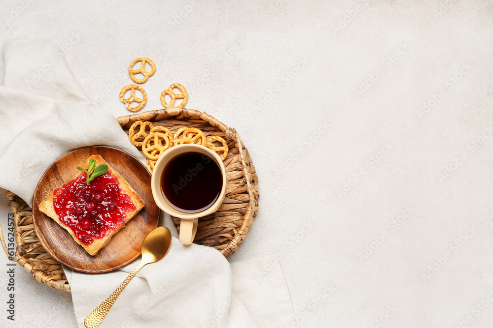 Tasty toast with cranberry jam and cup of coffee on light background