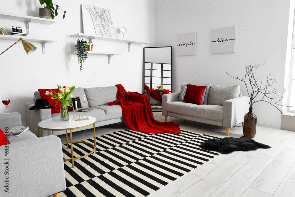 Interior of stylish living room with cozy sofas and coffee table