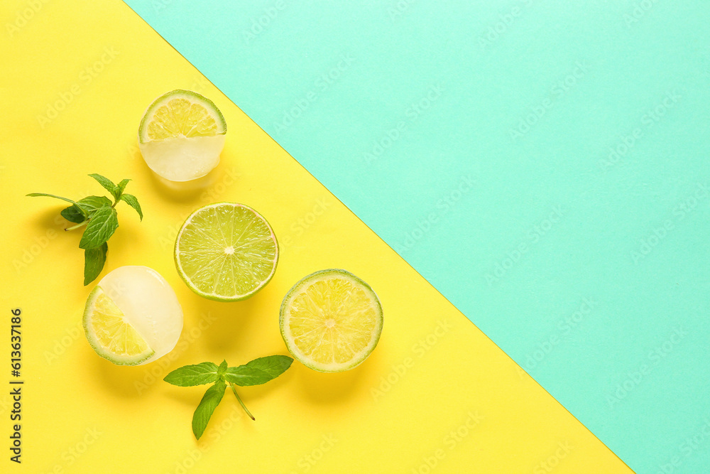 Fresh lime and slices frozen in ice with mint on color background