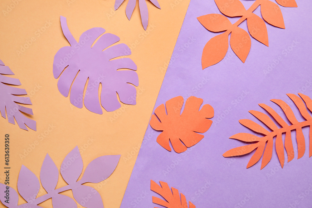 Beautiful origami leaves on color background