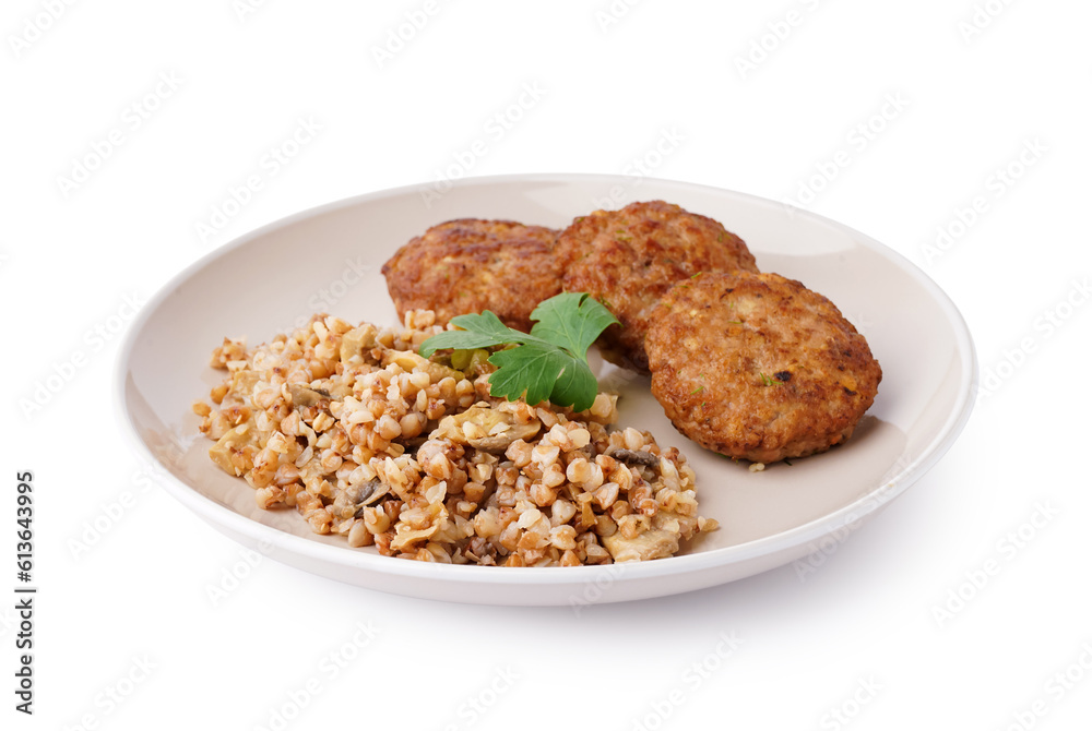 Cutlets with buckwheat, mushrooms and parsley on white background