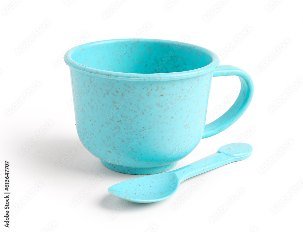 Blue cup with spoon isolated on white background. Childrens Day celebration