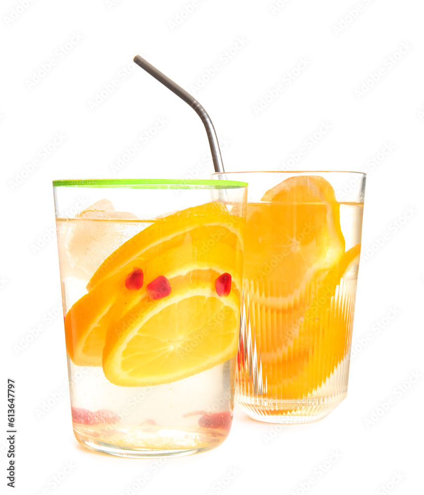 Glasses of infused water with orange slices on white background