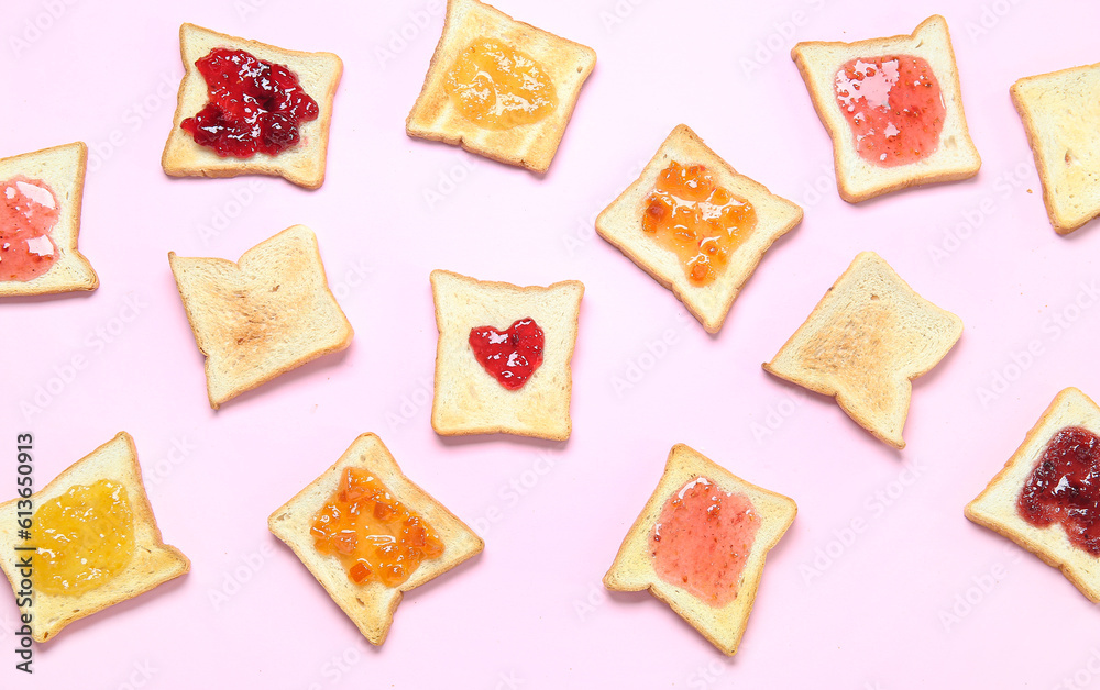 Many toasts with different jams on pink background