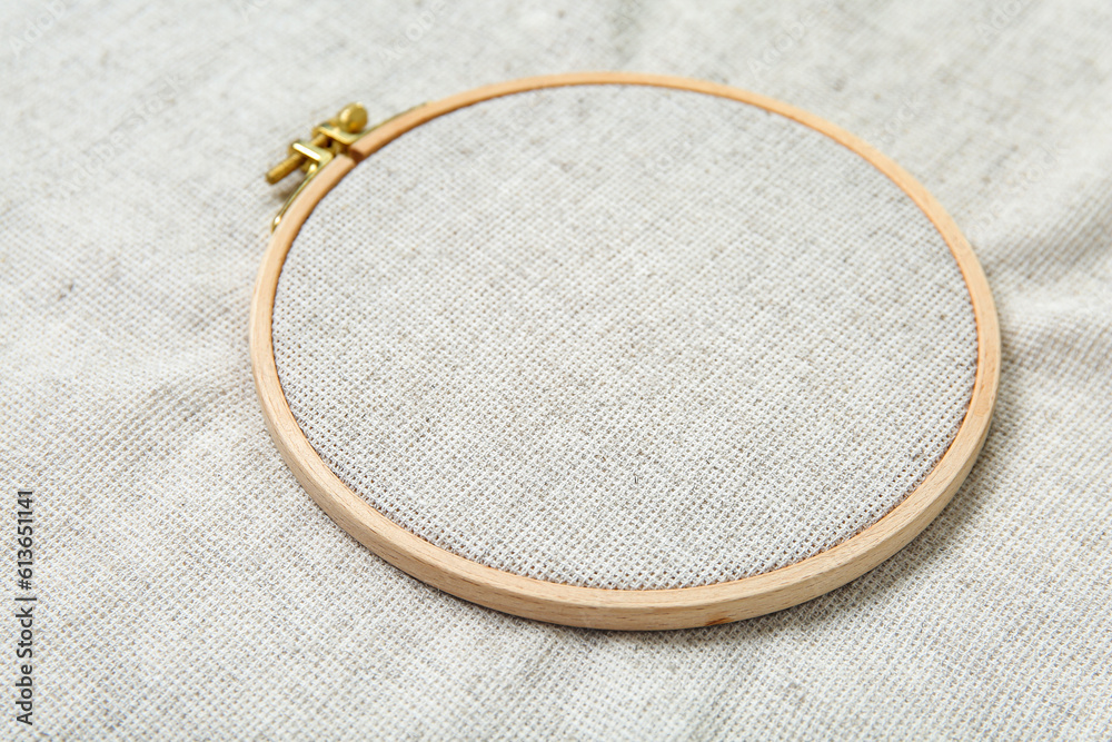 Wooden embroidery hoop with canvas as background