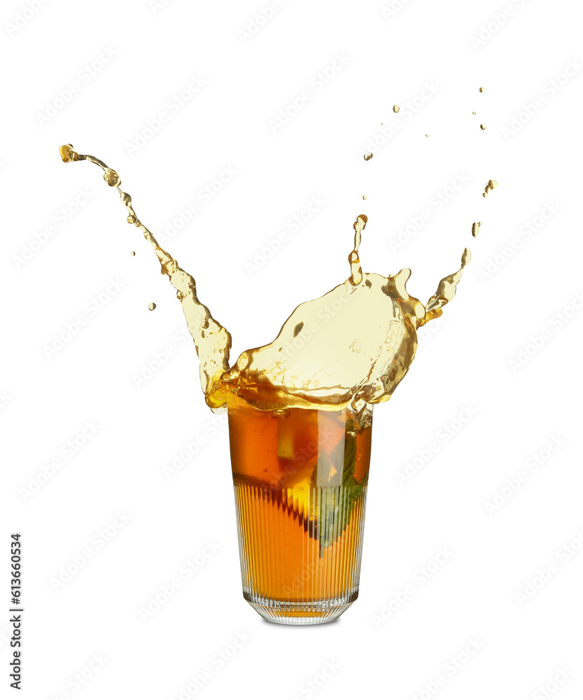 Glass of ice tea with splashes on white background