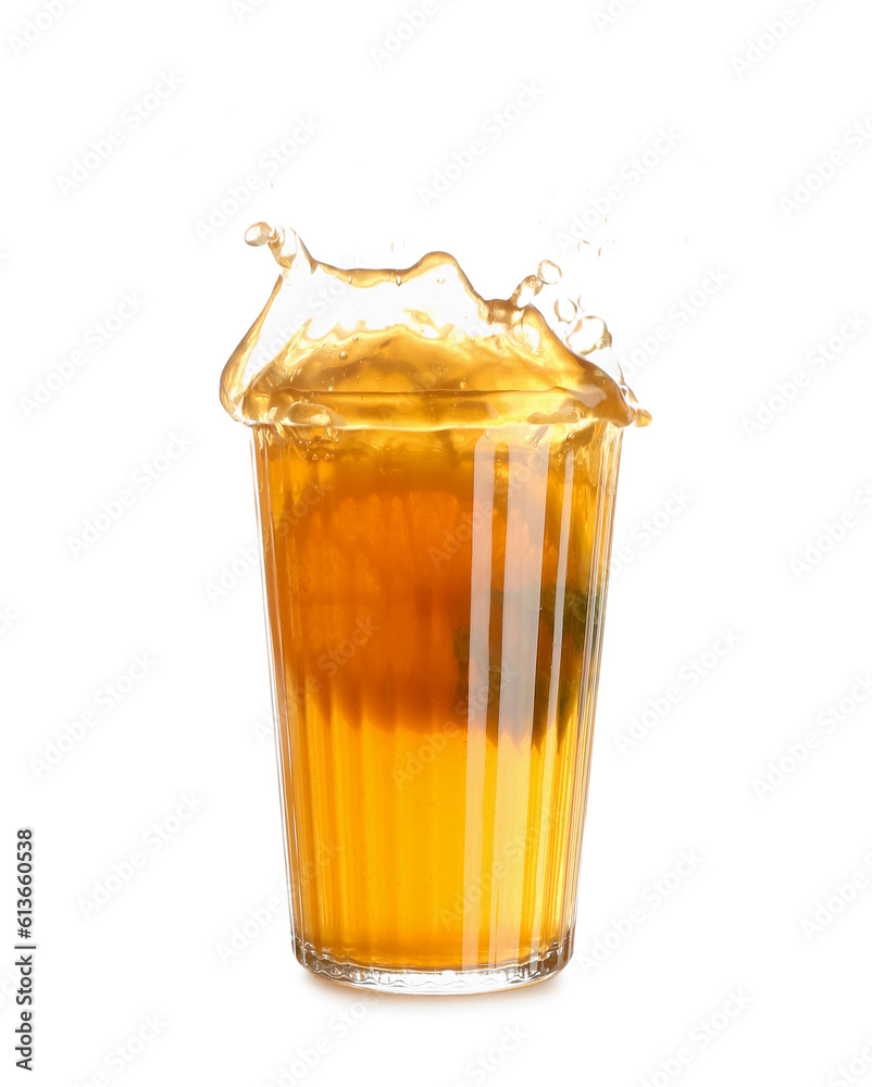 Glass of ice tea with splashes on white background