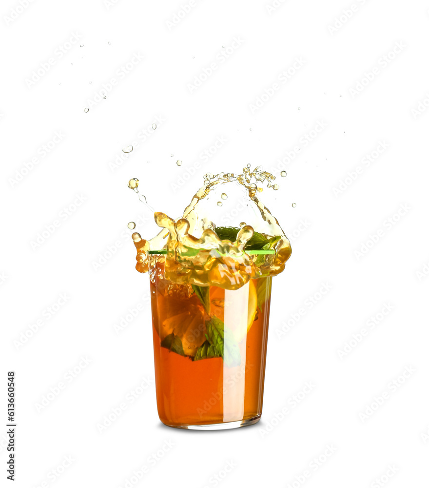 Glass of ice tea with splashes on white background