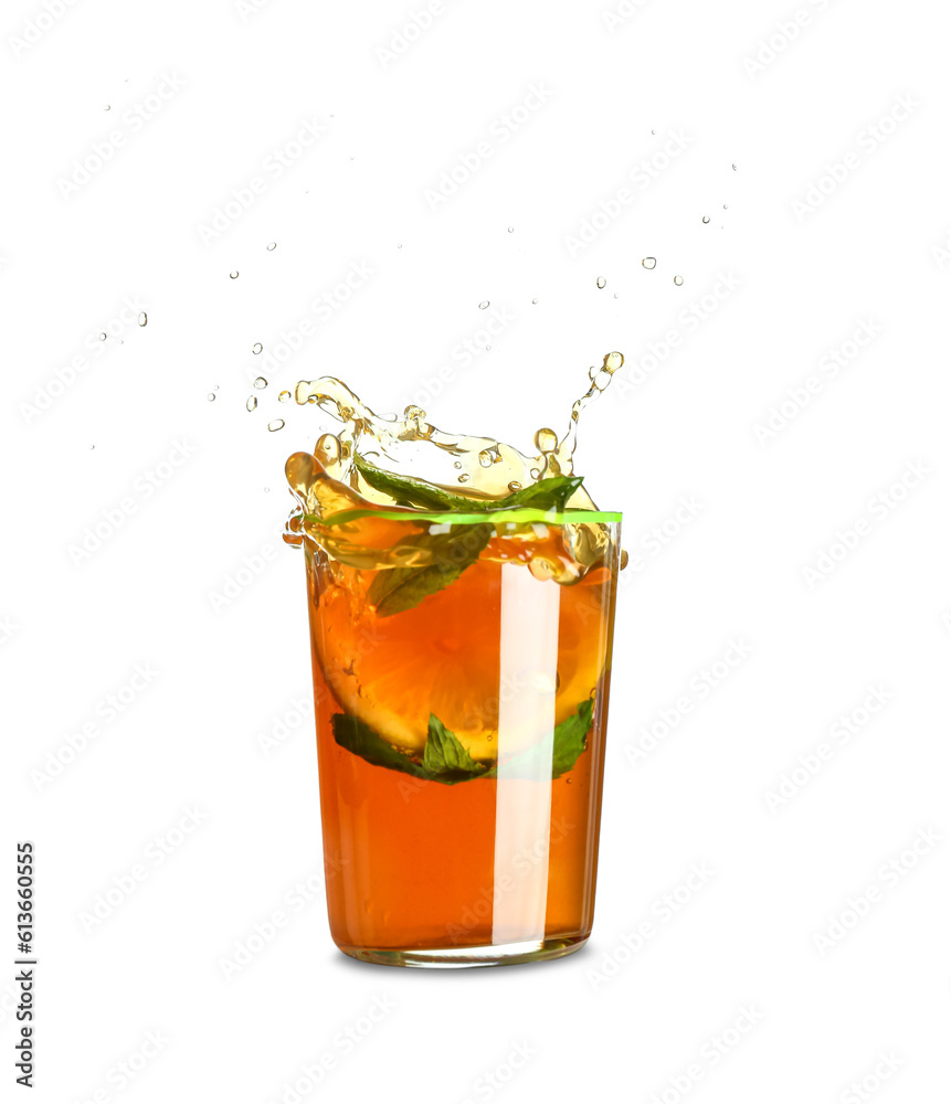 Glass of ice tea with splashes on white background