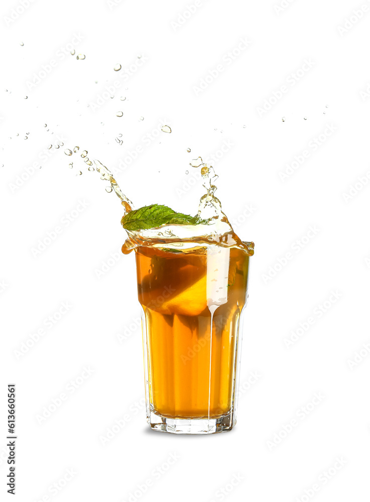 Glass of ice tea with splashes on white background