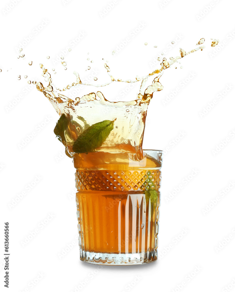 Glass of ice tea with splashes on white background