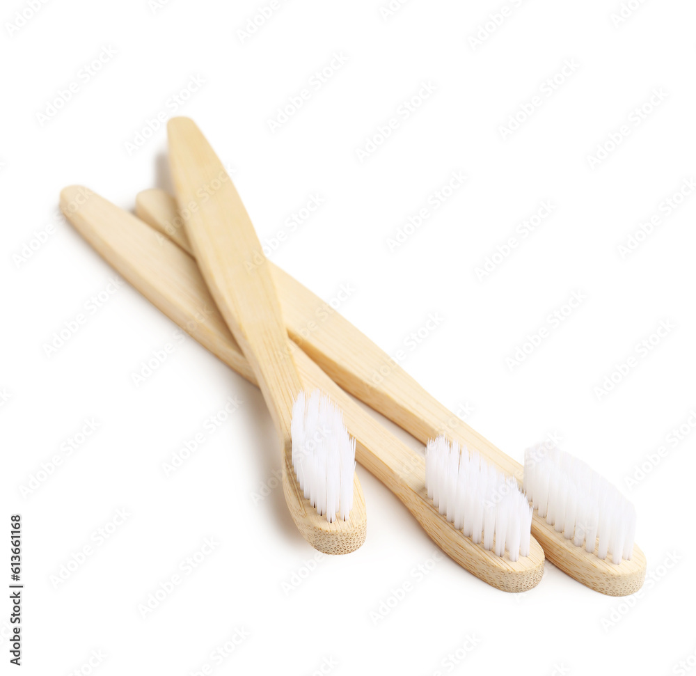 Bamboo toothbrushes on white background