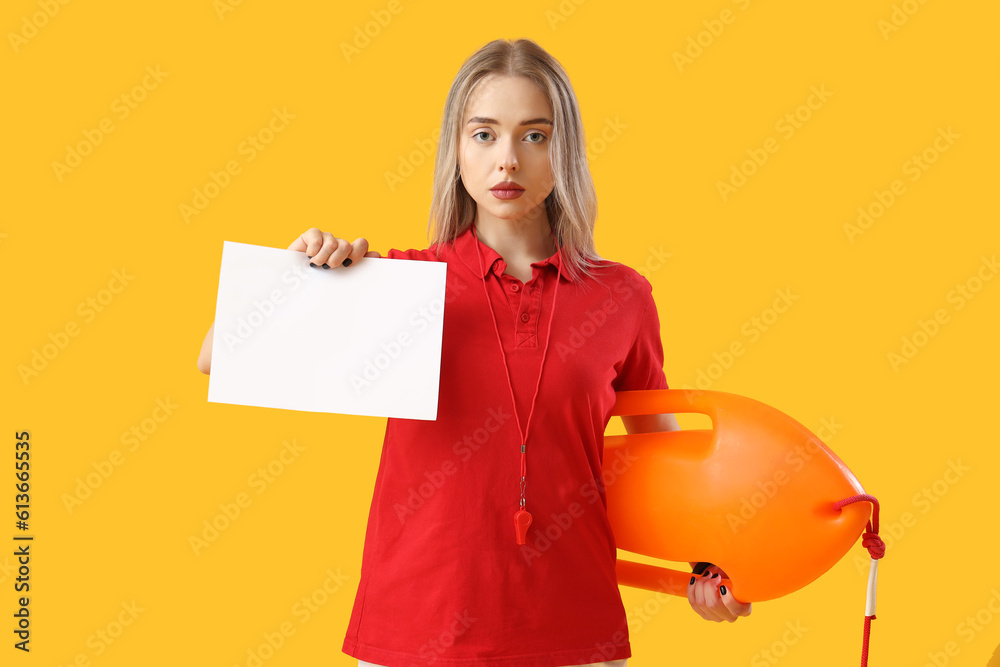 Female lifeguard with rescue buoy and blank paper on yellow background