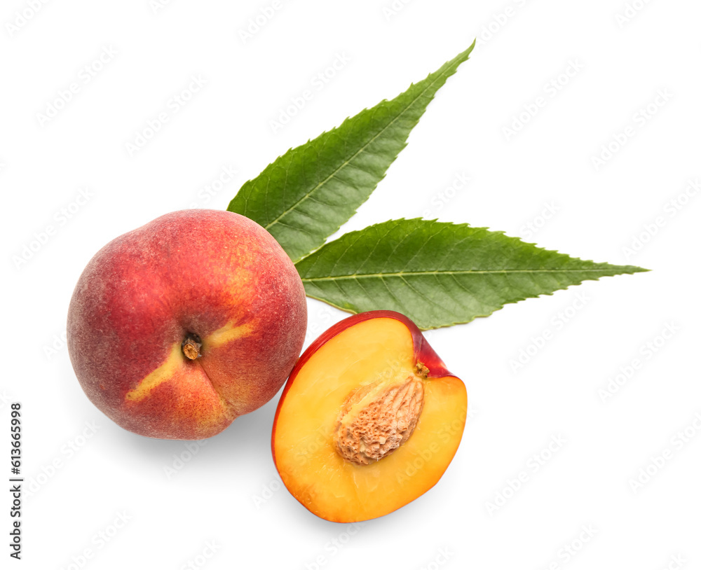 Half of sweet peach and leaves on white background