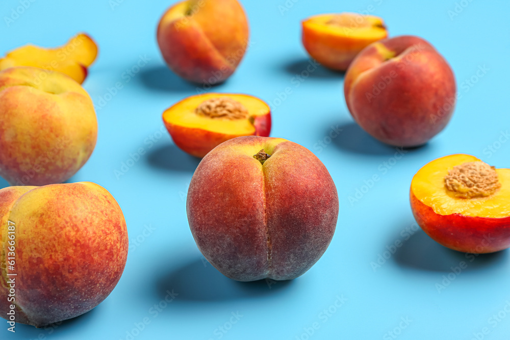 Sweet peaches on blue background