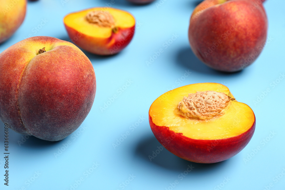 Sweet peaches on blue background