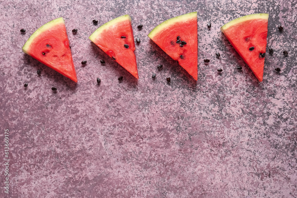 Pieces of fresh watermelon on purple background