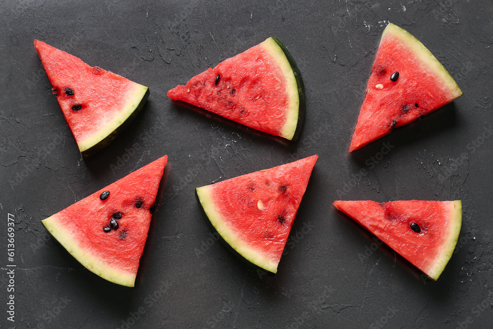 Pieces of fresh watermelon on black background