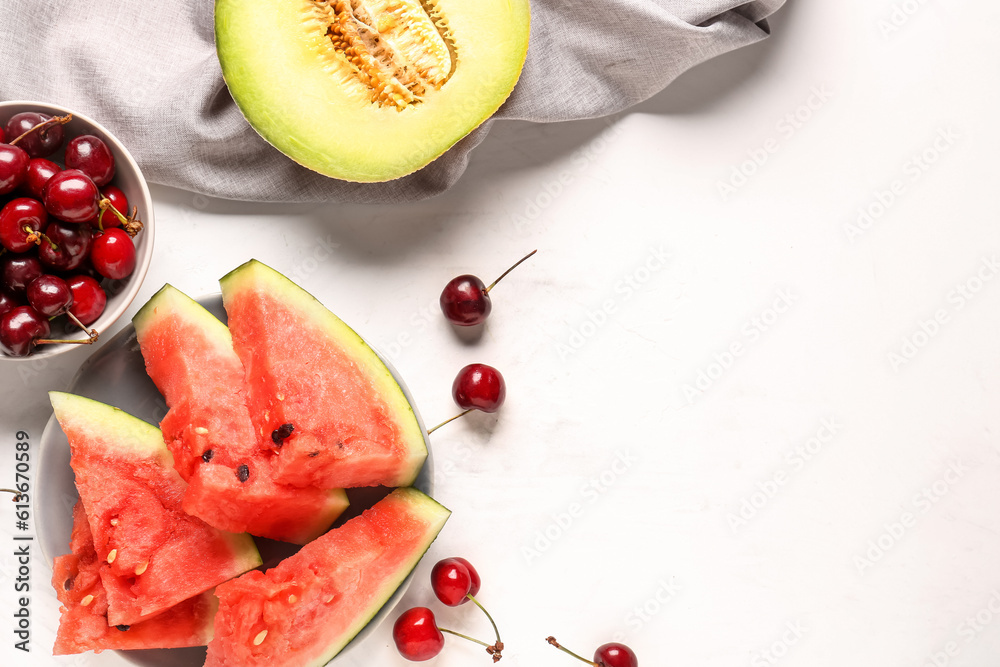 Bowl with pieces of fresh watermelon and different berries on white background