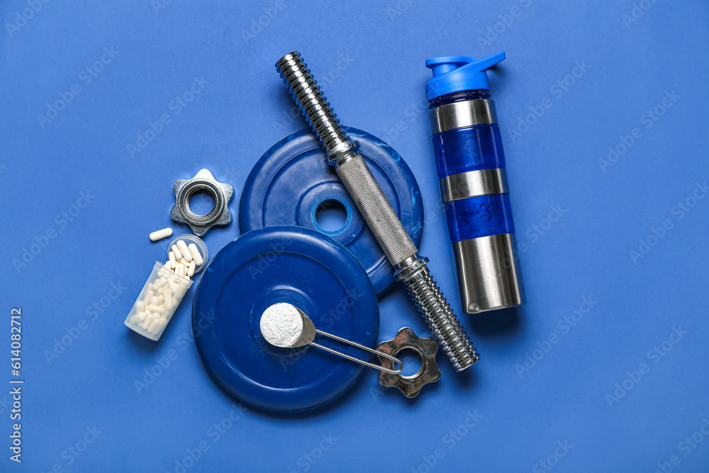 Sports equipment, bottle of water, amino acid pills and powder on color background