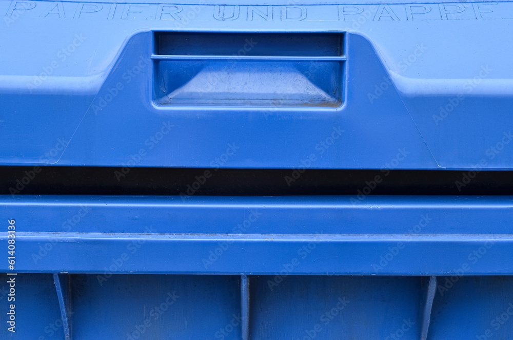 View of blue garbage container in city, closeup