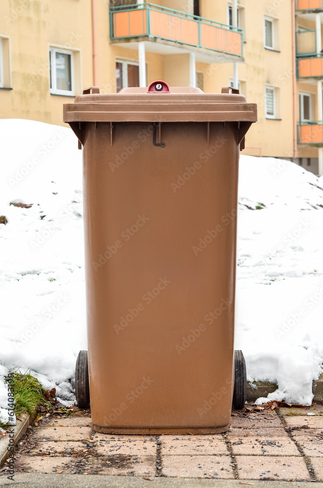 View of garbage container in city on winter day