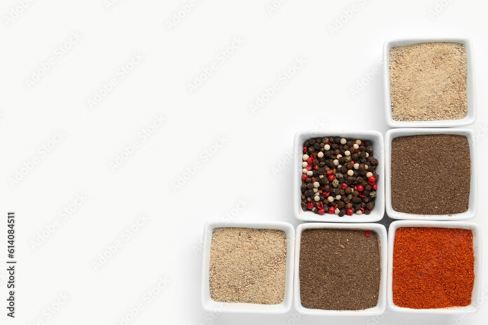 Composition with bowls of fresh aromatic spices on light background