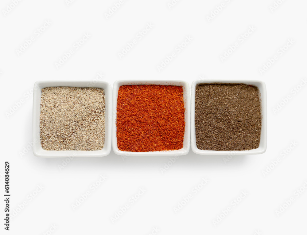 Bowls of fresh aromatic spices on white background