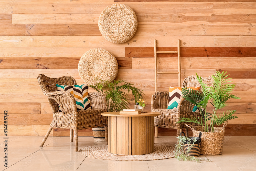 Interior of stylish living room with wicker armchairs and coffee table