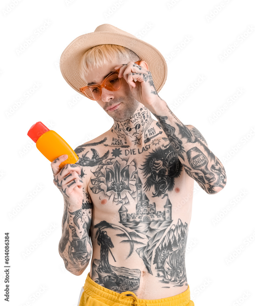 Tattooed man with sunscreen cream on white background