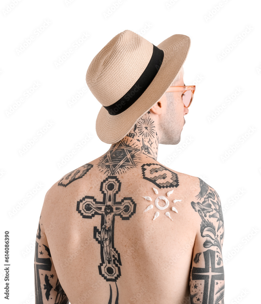 Tattooed man with sunscreen cream on his skin against white background