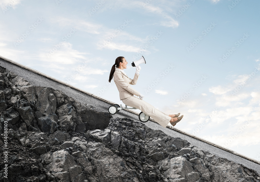 Woman shouting into megaphone and riding