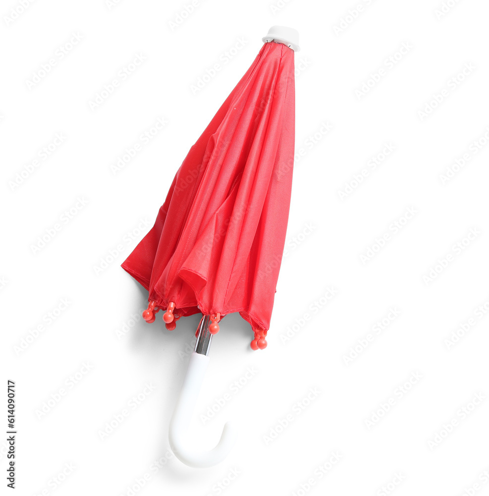 Mini red umbrella on white background