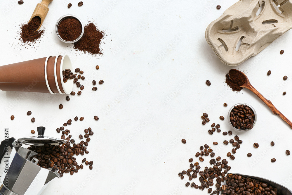 frame made of cups, holder, geyser coffee maker and beans on light background