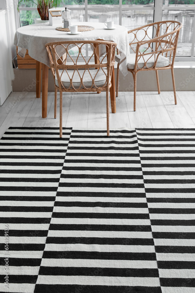 Stylish striped carpet in interior of modern kitchen